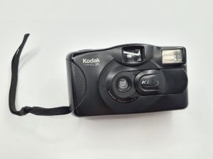 A vintage Kodak film camera, symbolizing the camera phobia felt by 90s kids due to having limited photo exposures. 
