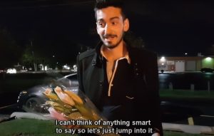 A video still from the grand finale of my first YouTube video, holding flowers just before the surprise family reunion. 