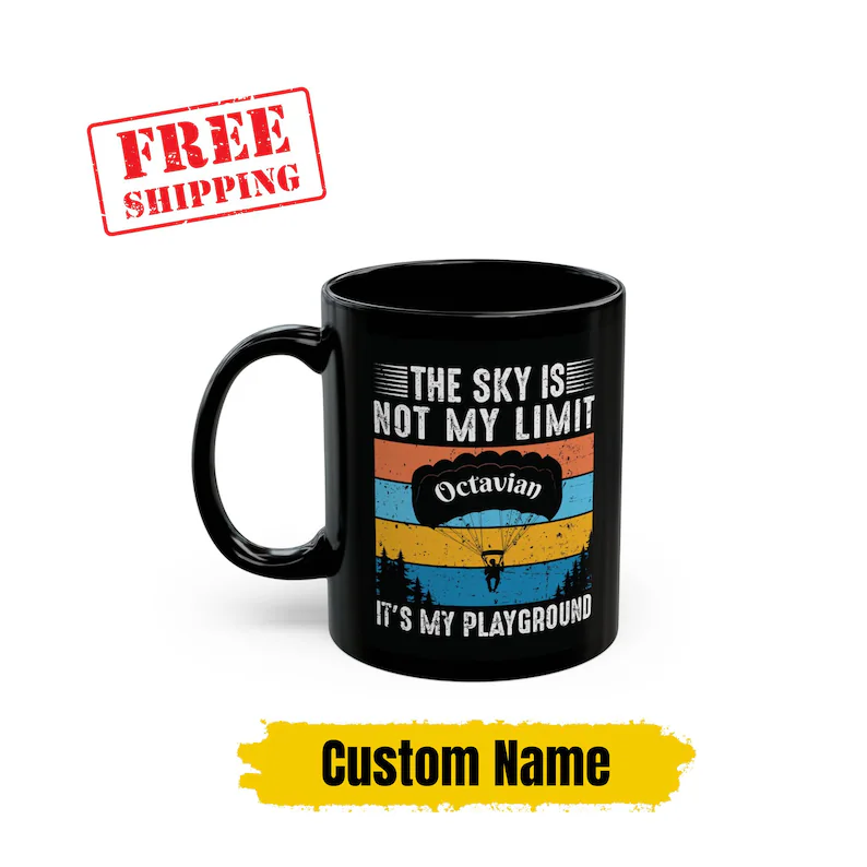 Personalized skydiving mug in black, featuring a custom name and the quote "The sky is not my limit, it's my playground," making it a unique gift for a skydiver.